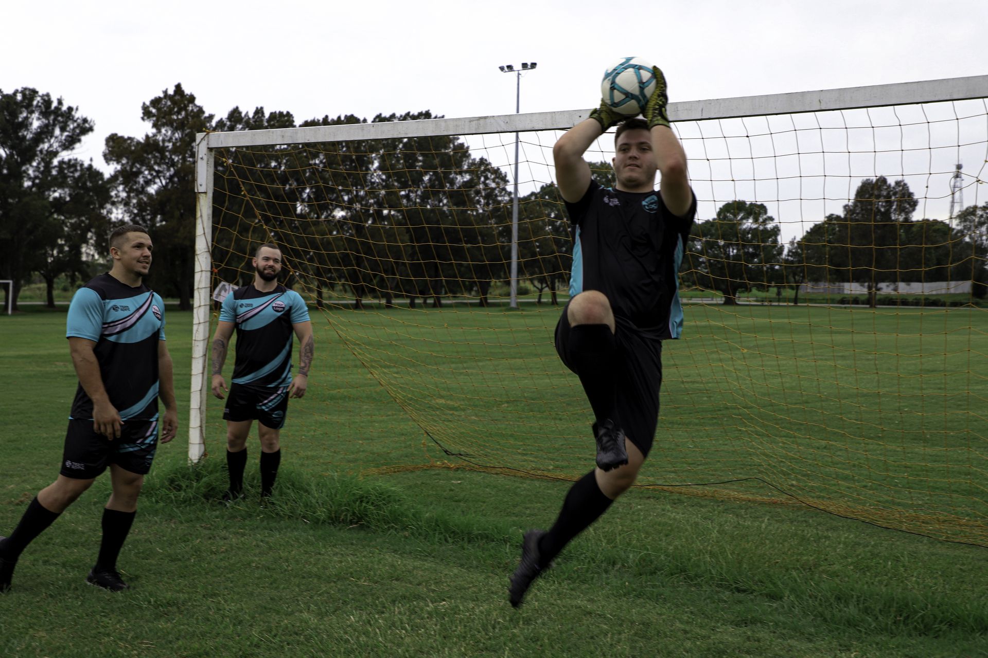 soccer players playing in matching custom shorts